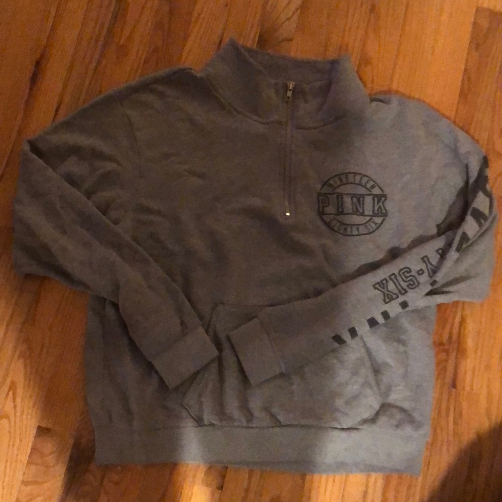 Good used condition. Grey and black pink quarter zip.